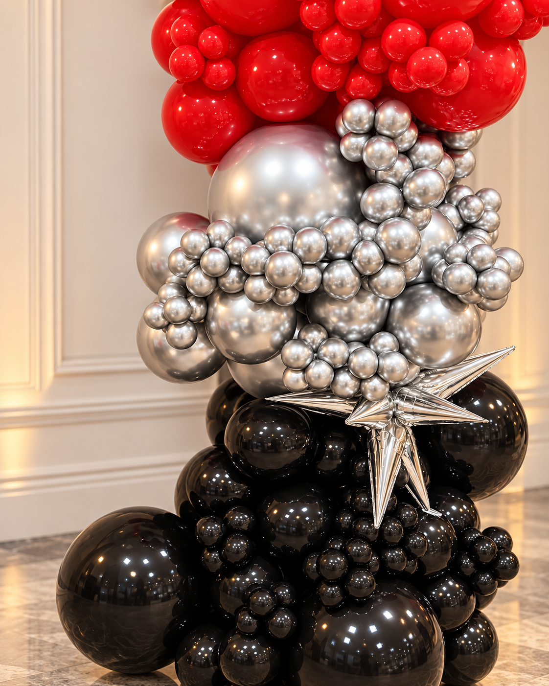 Red silver and black balloon installation